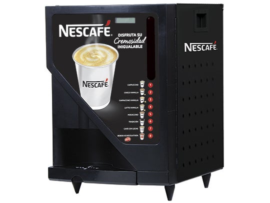 Una máquina de café NESCAFÉ® Lioness en color negro en un entorno moderno, con botones digitales.
