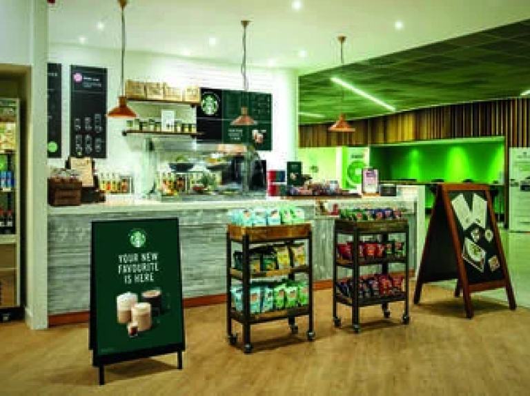 Punto de servido del we proudly serve STARBUCKS™