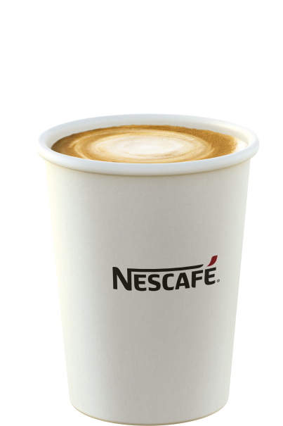 Vaso blanco de Nescafé con café en su interior