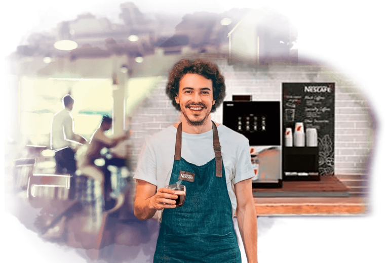 Barista sostiene un vaso de café y tras él, una Máquina NESCAFÉ® de grano sobre la barra de una cafetería
